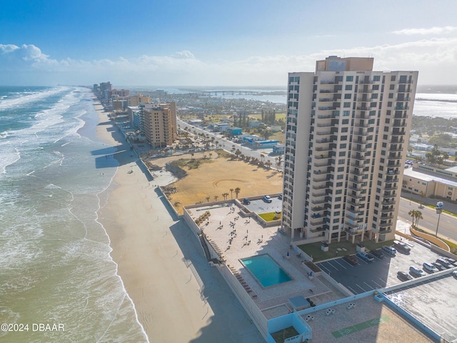 birds eye view of property featuring a view of the beach and a water view