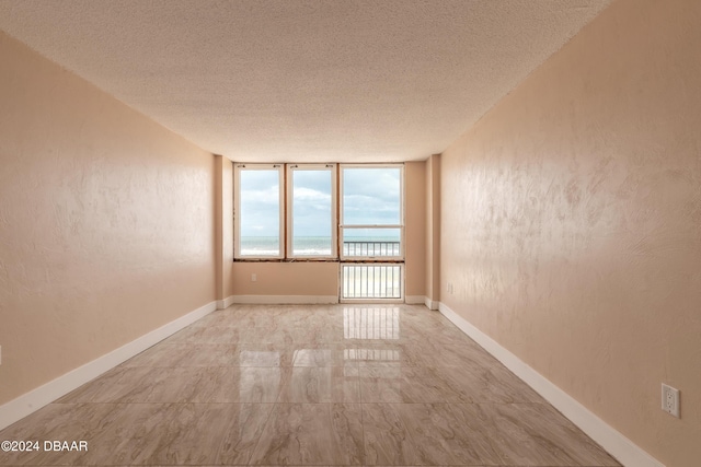 empty room with a textured ceiling