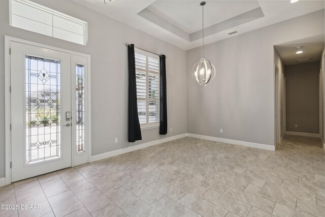 336 Stirling Bridge Dr, Ormond Beach, FL 32174 - foyer featuring a chandelier and a raised ceiling