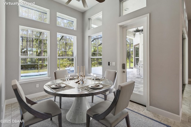 336 Stirling Bridge Dr, Ormond Beach, FL 32174 - dining area with a ceiling fan and a towering ceiling