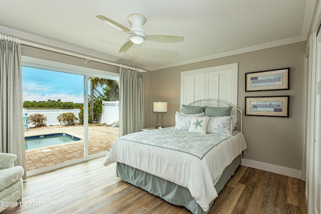 bedroom with access to outside, wood-type flooring, ornamental molding, a textured ceiling, and ceiling fan