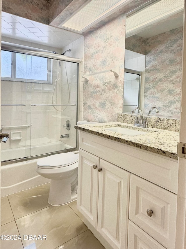 5 Wild Rose Pl, Palm Coast, FL 32164 - full bathroom featuring shower / bath combination with glass door, tile patterned floors, toilet, and vanity