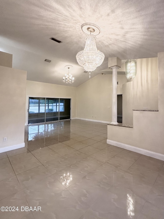 5 Wild Rose Pl, Palm Coast, FL 32164 - empty room featuring a chandelier, a textured ceiling, and ornate columns