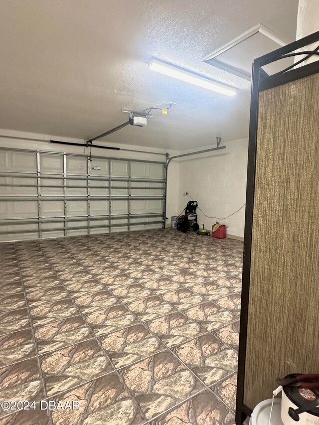 5 Wild Rose Pl, Palm Coast, FL 32164 - garage featuring a garage door opener