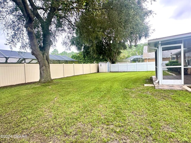 5 Wild Rose Pl, Palm Coast, FL 32164 - view of yard with a sunroom