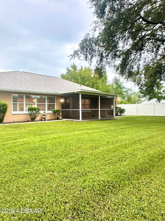 5 Wild Rose Pl, Palm Coast, FL 32164 - view of yard with a sunroom
