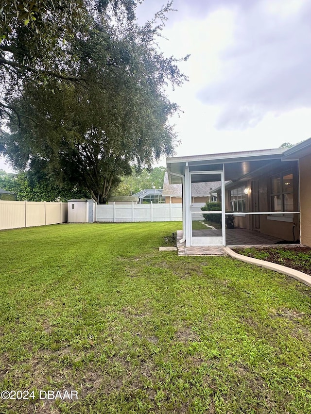 5 Wild Rose Pl, Palm Coast, FL 32164 - view of yard with a sunroom