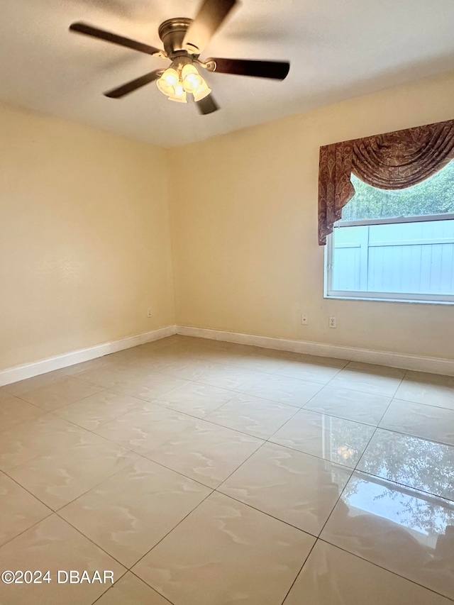 5 Wild Rose Pl, Palm Coast, FL 32164 - spare room featuring ceiling fan and light tile patterned floors