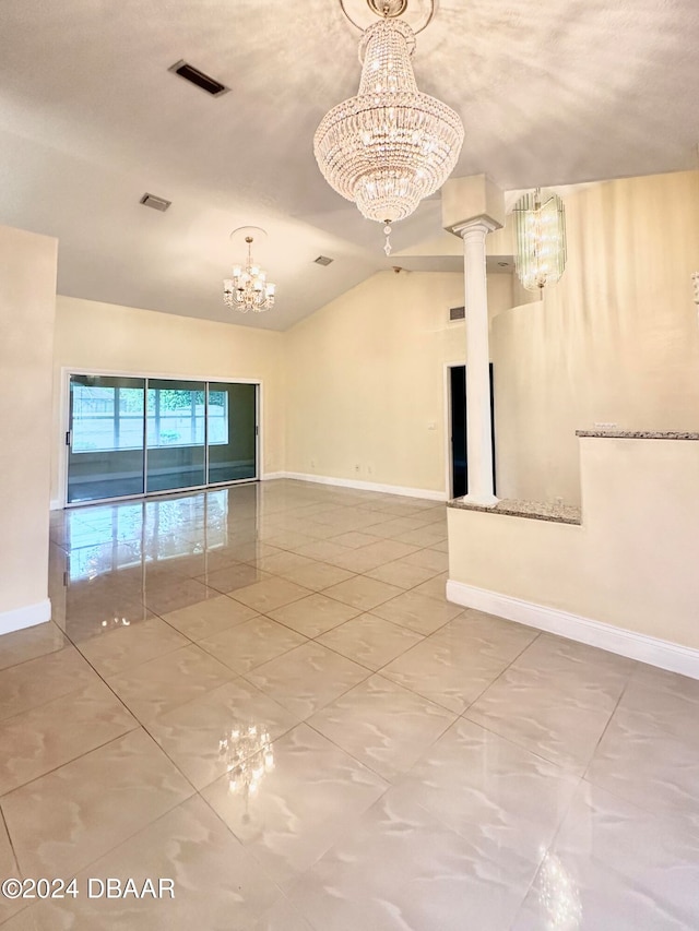 5 Wild Rose Pl, Palm Coast, FL 32164 - unfurnished room with decorative columns, lofted ceiling, an inviting chandelier, and a textured ceiling