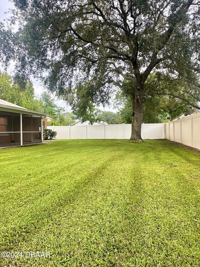 5 Wild Rose Pl, Palm Coast, FL 32164 - view of yard featuring a sunroom