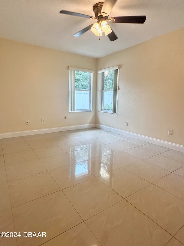 5 Wild Rose Pl, Palm Coast, FL 32164 - spare room with light tile patterned floors and ceiling fan