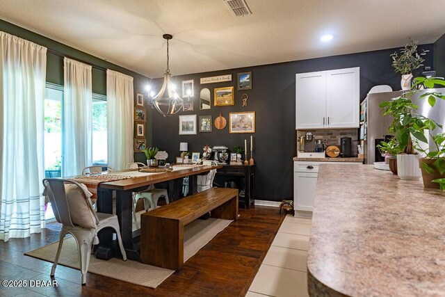 2756 Star Coral Ln, New Smyrna Beach, FL 32168 - dining room with a chandelier, recessed lighting, and dark wood-style flooring