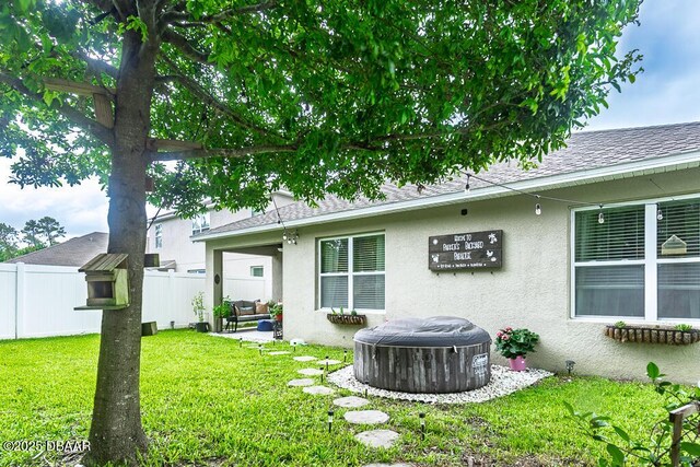 2756 Star Coral Ln, New Smyrna Beach, FL 32168 - rear view of property with stucco siding, a shingled roof, and central AC