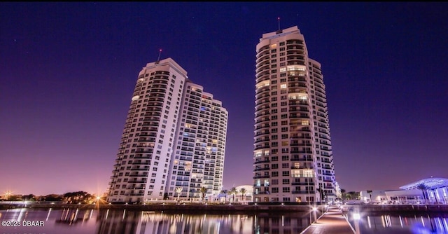 231 Riverside Dr Unit 2409, Holly Hill, FL 32117 - property at twilight featuring a water view and a view of city lights