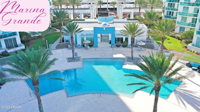 pool featuring a patio area and fence