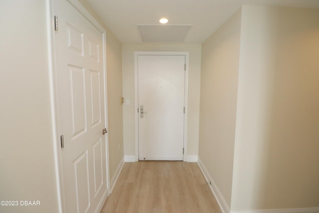 231 Riverside Dr Unit 2409, Holly Hill, FL 32117 - hallway featuring light wood-type flooring and baseboards