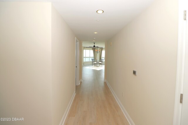 231 Riverside Dr Unit 2409, Holly Hill, FL 32117 - hallway featuring light wood finished floors, baseboards, and recessed lighting