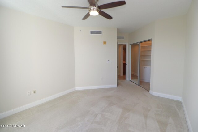 spacious closet featuring light carpet