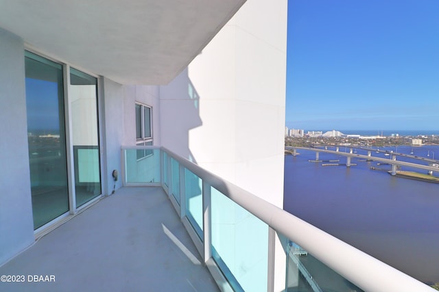 balcony featuring a water view