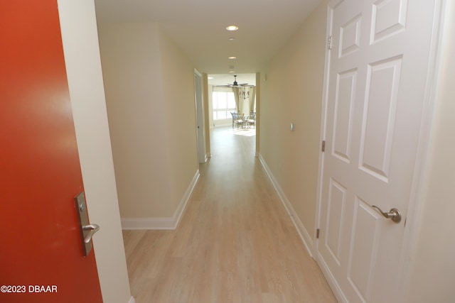 hall with light hardwood / wood-style floors