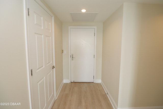 hall with light hardwood / wood-style flooring