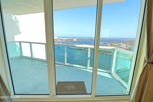 231 Riverside Dr Unit 2409, Holly Hill, FL 32117 - doorway to outside with carpet, a water view, and a view of city