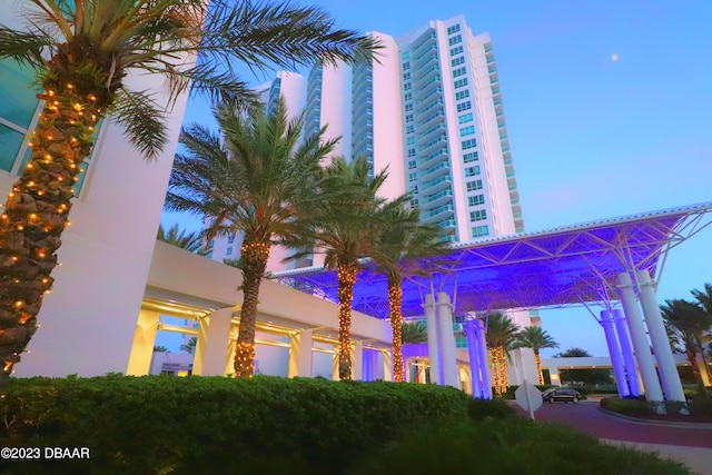 view of outdoor building at dusk