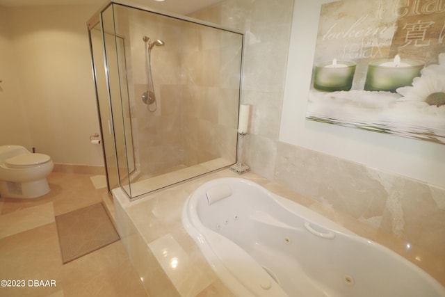 bathroom with toilet, tile patterned flooring, and separate shower and tub