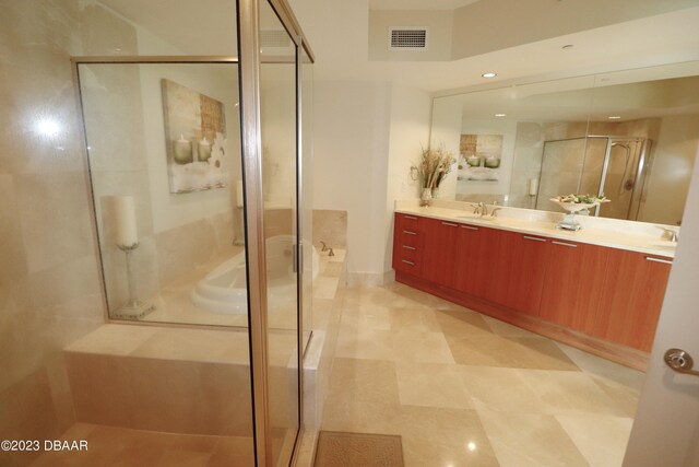 231 Riverside Dr Unit 2409, Holly Hill, FL 32117 - full bathroom with a shower stall, a garden tub, double vanity, and recessed lighting