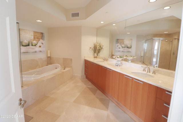 bathroom featuring plus walk in shower and vanity