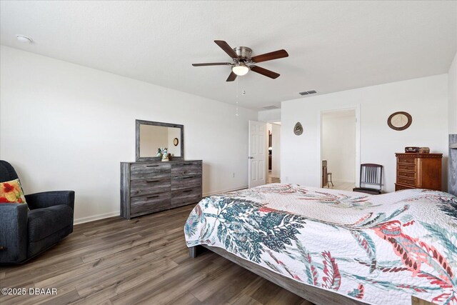 20 Willow St, Palm Coast, FL 32164 - bedroom with ceiling fan, visible vents, baseboards, and wood finished floors