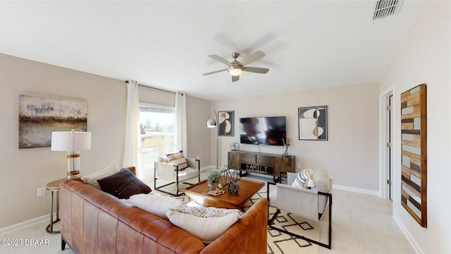 3988 Willowbrook Dr, Edgewater, FL 32141 - living area featuring a ceiling fan and baseboards