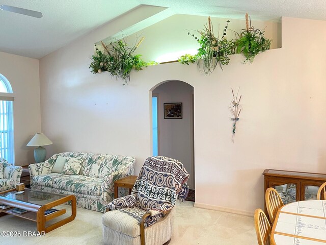 bathroom featuring beamed ceiling, vanity, tile patterned floors, and toilet