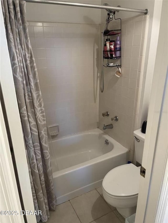 bathroom featuring shower / bath combination with curtain, tile patterned floors, and toilet