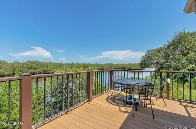 wooden deck with a water view