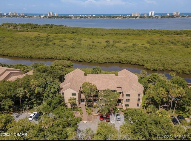 birds eye view of property featuring a water view