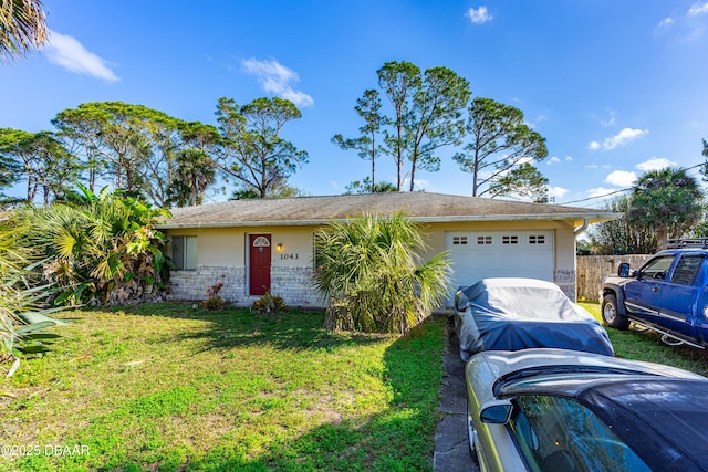 ranch-style house with a garage, brick siding, a front yard, and fence