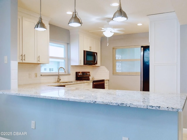 kitchen featuring white cabinetry, sink, electric range, and refrigerator