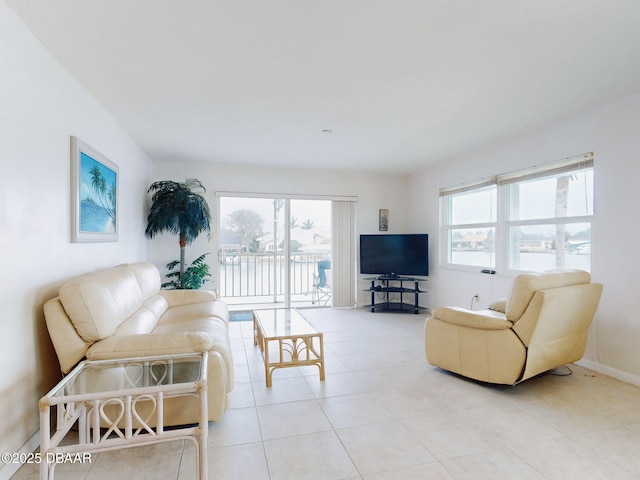 tiled living room with plenty of natural light