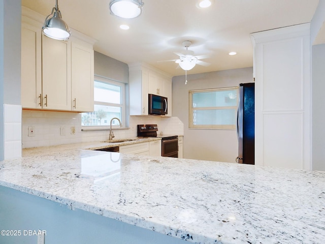 kitchen featuring tasteful backsplash, white cabinetry, and appliances with stainless steel finishes