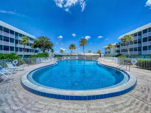 view of swimming pool featuring a patio area