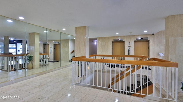 interior space with elevator and light tile patterned floors