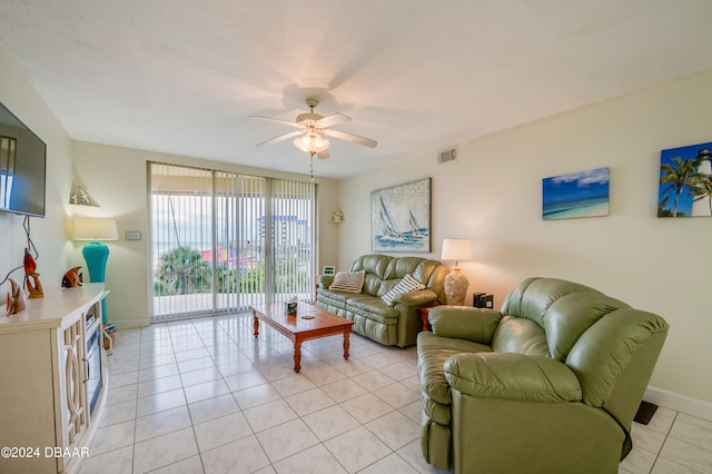 tiled living room featuring ceiling fan