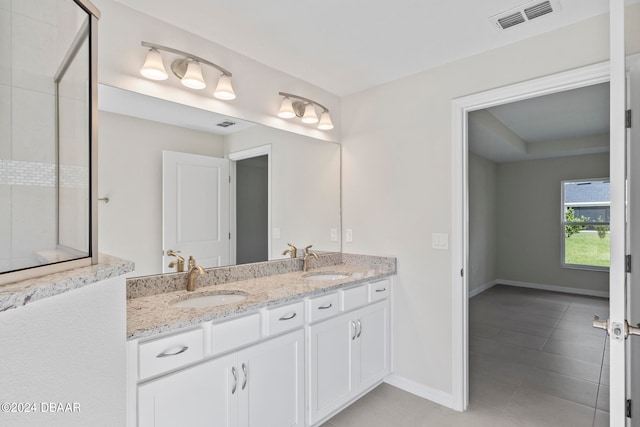 bathroom with vanity and tile patterned floors