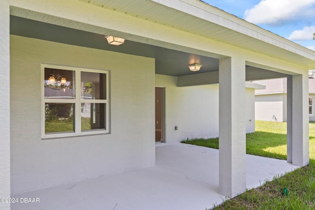 property entrance with a patio area