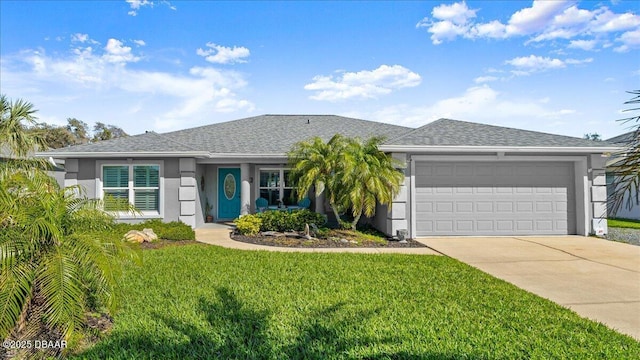 view of front of property with a front yard, a garage, driveway, and stucco siding