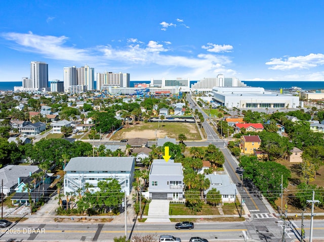 drone / aerial view with a view of city and a water view