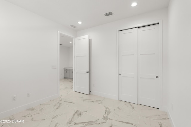 unfurnished bedroom with visible vents, baseboards, recessed lighting, and marble finish floor