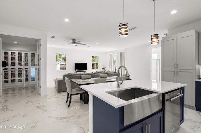 kitchen featuring a sink, pendant lighting, recessed lighting, and marble finish floor