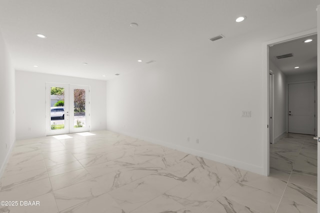 unfurnished room featuring french doors, recessed lighting, marble finish floor, and visible vents